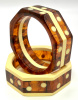 SZ22 Two Shultz octagon bangles in laminated custard and tortoise bakelite with custard dots